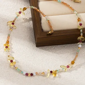 Close-up detail of multi-stone beaded necklace with natural crystals and titanium steel clasp.