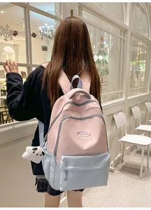 Backpack detail view showing the cute Korean style college design and waterproof fabric.
