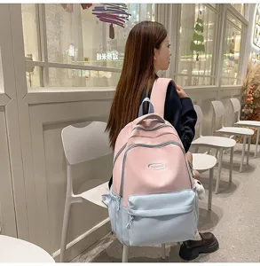 Pink and blue large capacity student backpack, Korean style waterproof school bag detail.
