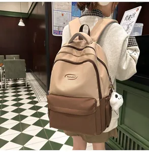 Close-up detail shot of the korean style canvas backpack with color blocking and large capacity.