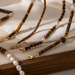 Details of retro tiger eye stone pearl necklace layered design, elegant 18k gold plated jewelry.