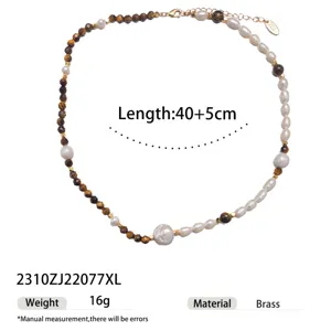Detailed view of the elegant pearl and tiger eye stone necklace with brass accents and adjustable.