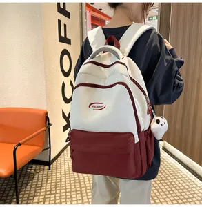 Korean style contrast color large capacity student backpack for daily casual commuting use.