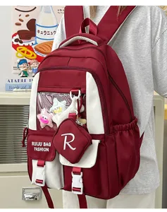 Detailed shot of a stylish red and white ita backpack featuring a transparent front window.
