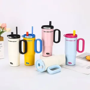 Detailed view of large capacity stainless steel insulated tumblers with handles and straws.