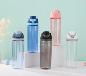 Detailed view of colorful plastic sports water bottles with straw and clean display setup.