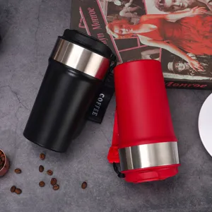 Portable stainless steel coffee mug with strap, dual color travel thermos for outdoor use.