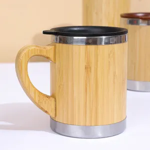 Bamboo stainless steel coffee mug with wooden handle detail shot, rustic water cup.