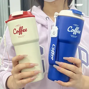 Stainless steel thermos coffee mug portable travel cup with strap for women daily use.