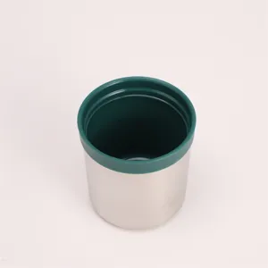 Stainless steel vacuum insulated travel mug interior detail view showing green rim.
