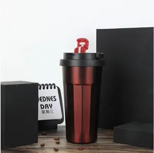 Stainless steel thermal coffee cup with handle, portable travel mug for car and office use.