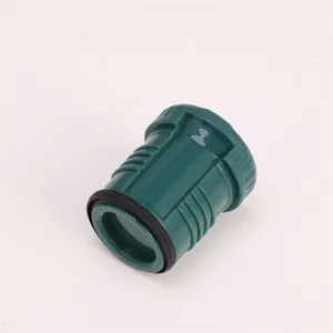 Green plastic water bottle accessory part with textured grip detail and black rubber seal ring