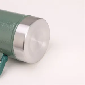 Stainless steel vacuum thermos bottle detail view featuring green hammertone finish and handle.