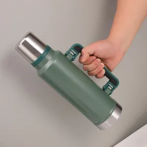 Detailed view of large capacity portable vacuum insulated water bottle with folding side handle.