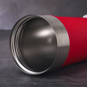 Close-up detail of stainless steel thermos coffee cup rim, inner thread and premium texture.