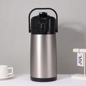 Stainless steel airpot detail showing press pump mechanism and handle on clean background.