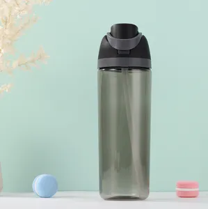 Close-up detail of the dark grey transparent plastic sports water bottle with straw and lid.