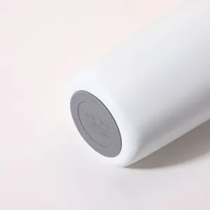 Detailed bottom view of stainless steel insulated travel tumbler with non-slip silicone base.