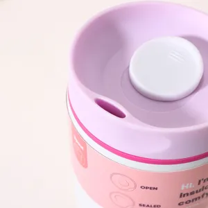 Close-up detail of the portable insulated coffee cup lid, showing the leak-proof button.