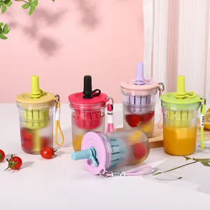 Detail shot of colorful plastic fruit tea cups featuring built-in strainers and lanyards.