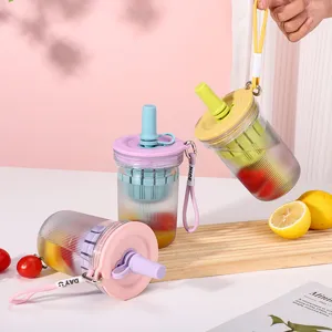 Detailed view of portable plastic fruit tea cup with straw, tea filter, and cute lanyard.