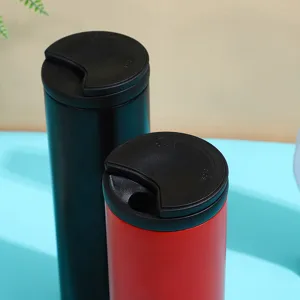 Stainless steel vacuum insulated tumbler detail shot, featuring black lid and metal body for daily drinks.