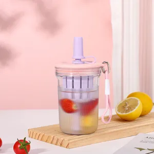 Portable plastic fruit tea cup with infuser, straw and lanyard for students and daily use.