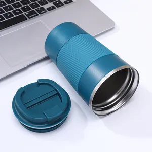 Stainless steel vacuum insulated coffee mug with non-slip silicone sleeve and lid.