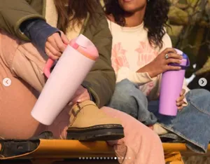 Large capacity insulated stainless steel tumbler with handle for outdoor travel and daily use.