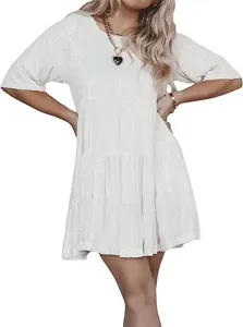 Stunning white sequin tiered mini dress featuring a classic round neck and short sleeves for chic parties.