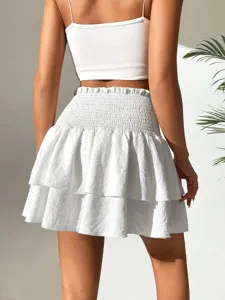 Jupe mini blanche taille haute à volants d'été, jupe plissée unie pour femmes.