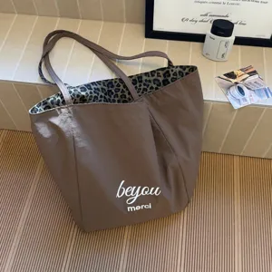 Large capacity brown canvas tote bag with leopard print lining for women casual daily use.
