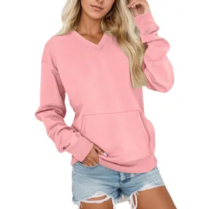 Casual pink V-neck long sleeve sweatshirt with front pocket paired with denim shorts.