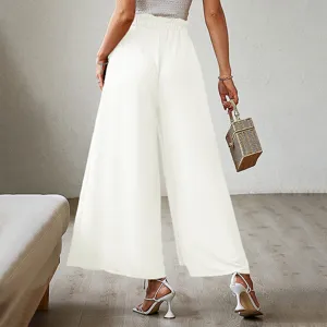 Detail view of women's white high waist pleated wide leg pants, elegant casual style.