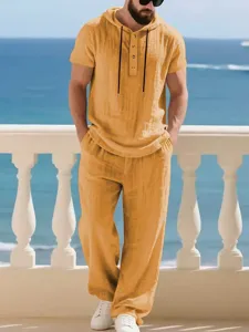 Detail shot of men's casual linen hooded short sleeve two-piece set in vibrant yellow.