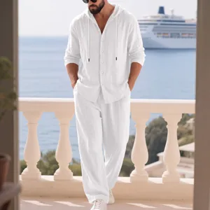 Detail view of men casual white linen hoodie shirt and long pants set for summer beach wear.