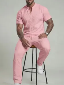 Men's summer casual two-piece V-neck short sleeve top and pants set in pink fashion.