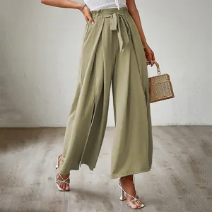 Detailed shot of women high waist wide leg pants featuring elegant bow belt and pleats.
