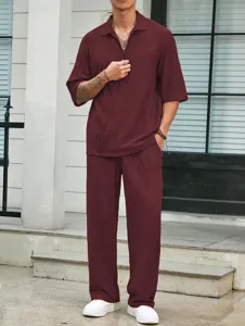Detail view of the casual men's two-piece outfit with short sleeve shirt and matching pants.