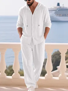 Men's white linen hooded long sleeve button down shirt and casual pants resort outfit set.