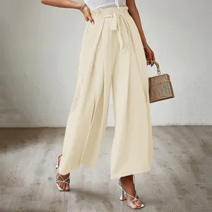 Detailed view of women's beige high waist wide leg pants with bow belt and pleated design.