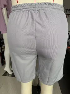 Men grey waffle knit casual shorts detail, comfortable elastic waist summer beach wear.