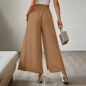 Back view detail of women high waisted pleated wide leg pants in brown, elegant style.