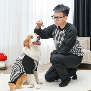 Detailed view of pet striped two-leg shirt dog apparel, comfortable round-neck matching outfit scene.
