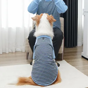 Detailed shot showing the soft striped pet shirt worn by a dog, highlighting neckline and back.