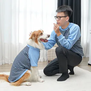 Pet and owner matching striped clothes detail, comfortable blue and black raglan sleeves.