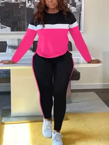 Detail view of women colorblock long sleeve top and pants set featuring stylish contrast stripe.