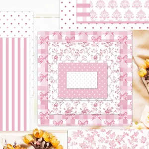 Macro detail of 13 types of pink floral and patterned scrapbook paper sheets.
