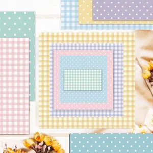 Detailed collage of various pastel plaid and polka dot pattern scrapbooking paper