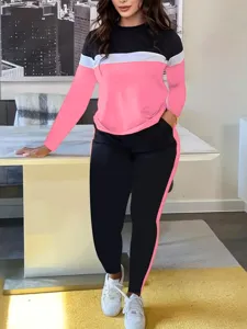 Stylish women color block long sleeve top and pants tracksuit casual activewear set.